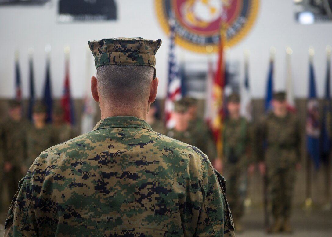 Maj. Robert M. Storck, operations officer for Headquarters and Headquarters Squadron, stands at attention for Anchors Aweigh during his retirement ceremony on Marine Corps Air Station Miramar, Calif., Mar. 8. The ceremony officially recognized Storck for his 20 years of honorable service to the Marine Corps from May 1999 to March 2019. (U.S. Marine Corps photo by Cpl. Becky Cleveland)