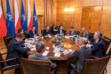 A group of people sit at a table.