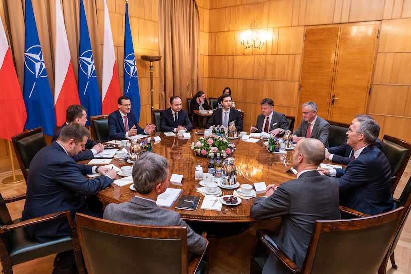 A group of people sit at a table.