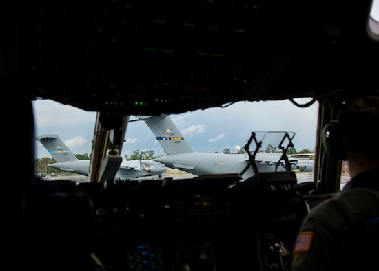 A C-17 Globemaster III from the 3rd Airlift Squadron, Dover Air Force Base, Del., lands in Gulfport, Miss., March 3, 2019, at the beginning of Exercise Jersey Devil 19. Aircraft from Dover AFB and Joint Base McGuire-Dix-Lakehurst, N.J., participated in the exercise to include the C-5M Supergalaxy, KC-10 Extender and C-17 Globemaster III. (U.S. Air Force photo by Airman 1st Class Zoe M. Wockenfuss)