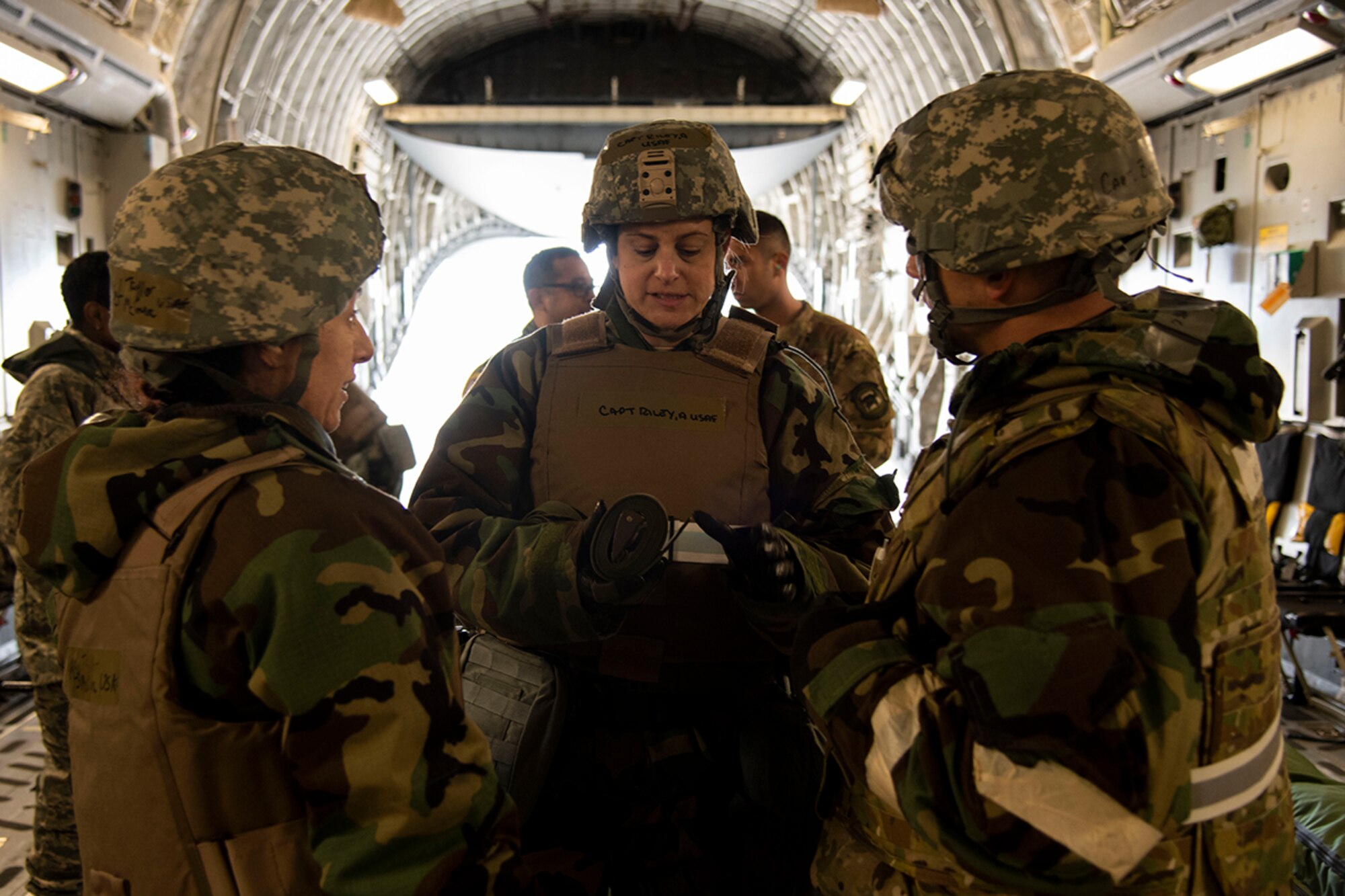 Members from the 514th Aeromedical Evacuation Squadron at Joint Base McGuire-Dix-Lakehurst, N.J., coordinate their efforts during Exercise Jersey Devil 19 aboard a C-17 Globemaster III March 4, 2019. Jersey Devil was aimed at preparing Airmen to respond to complex threats anywhere, anytime. (U.S. Air Force photo by Airman 1st Class Zoe M. Wockenfuss)