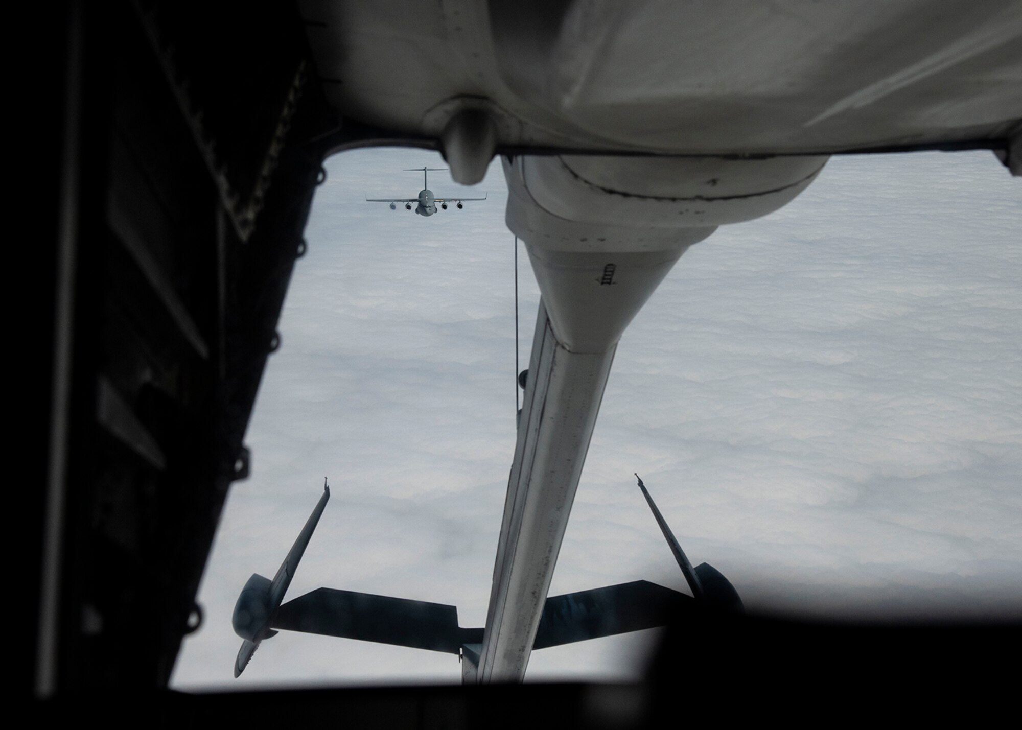 A C-17 Globemaster III from the 436th Airlift Squadron, Dover Air Force Base, Del., approaches a KC-10 Extender from the 305th Air Mobility Wing, Joint Base McGuire-Dix-Lakehurst, N.J., for an air refueling March 7, 2019, during Exercise Jersey Devil 19. Jersey Devil is a joint base exercise aimed at preparing Airmen to respond to complex threats posed by potential adversaries now and in the future. (U.S. Air Force photo by Airman 1st Class Zoe M. Wockenfuss)