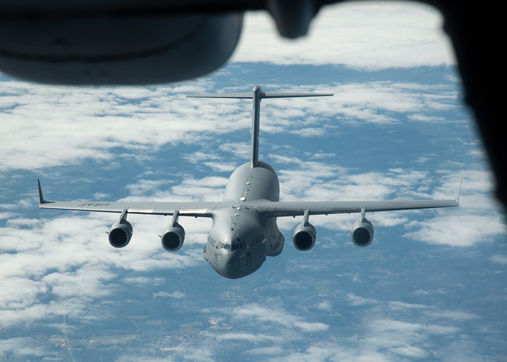 A C-17 Globemaster III from the 436th Airlift Wing, Dover Air Force Base, Del., flies behind a KC-10 Extender from the 305th Air Mobility Wing, Joint Base McGuire-Dix-Lakehurst, N.J., March 7, 2019, during Exercise Jersey Devil 19. Jersey Devil is the largest joint base mobility exercise since 2009 with six units including both active duty and reserve Airmen. (U.S. Air Force photo by Airman 1st Class Zoe M. Wockenfuss)