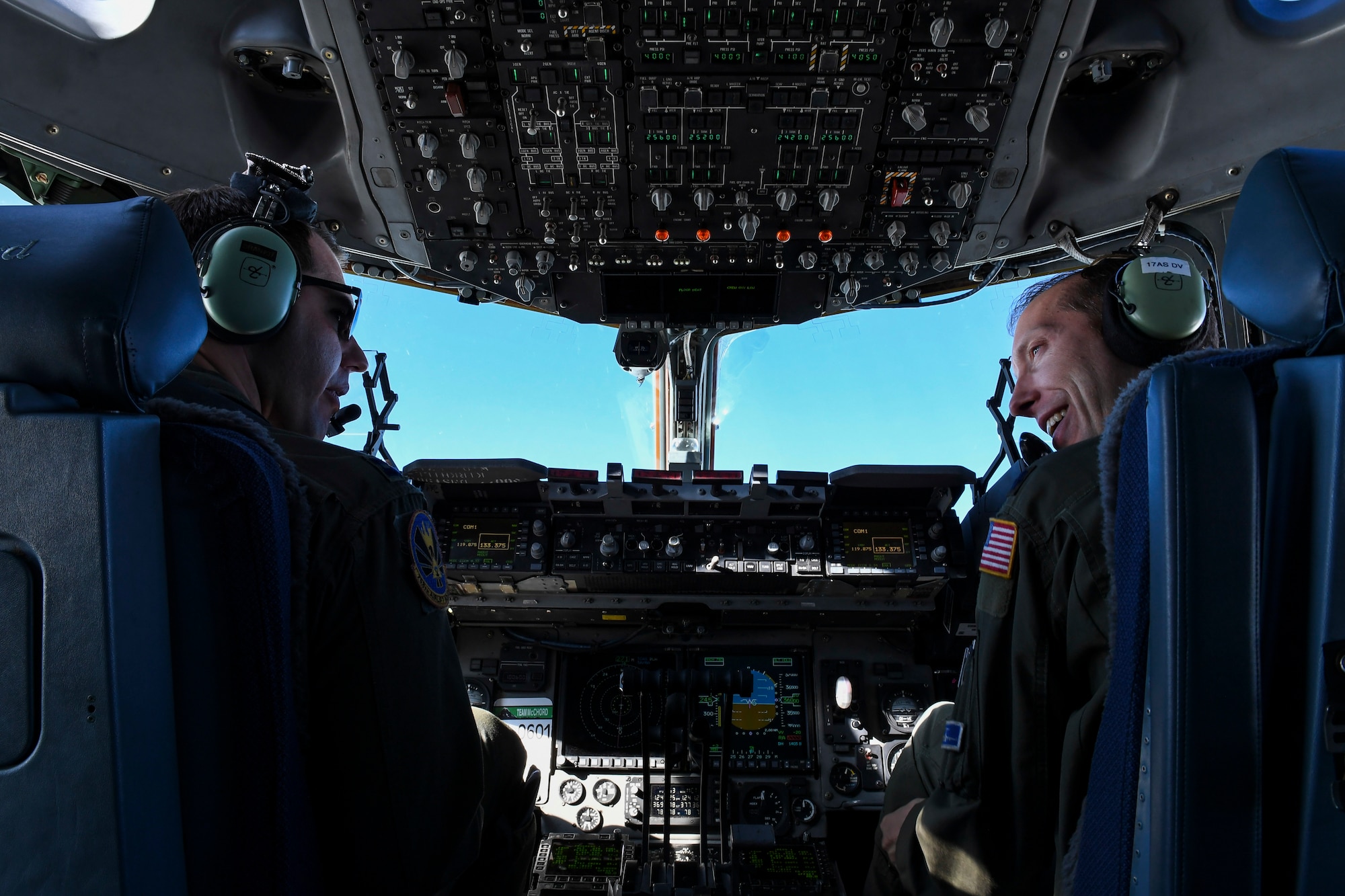 Capt. Brian Coble, co-pilot with the 758th Airlift Squadron talks to Lt. Col. Thomas Clark, evaluator pilot with the 911th Operational Support Squadron during a training flight from Pittsburgh International Airport Air Reserve Station, Pennsylvaniam, to March Air Reserve Base, Ca., March 3, 2019. The flight was used as a multi-purpose flight, training aircrew while taking members of the 911th Maintenance Group to March ARB to train on performing various maintenance tasks. (U.S. Air Force photo by Joshua J. Seybert)
