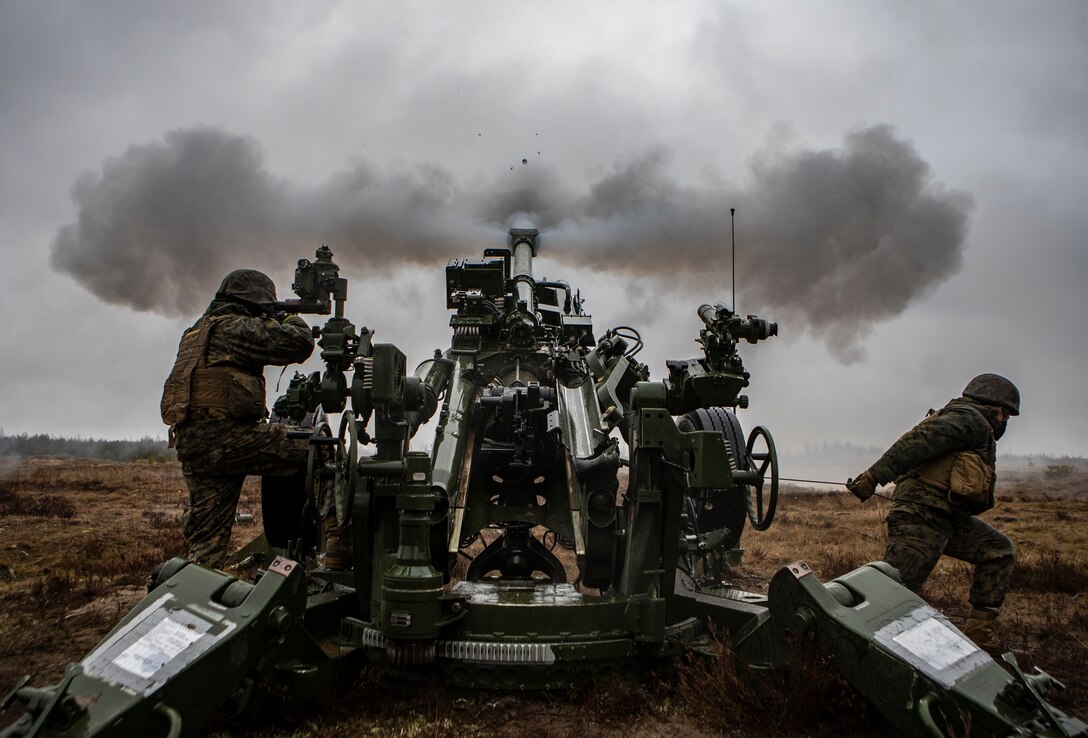 U.S. Marines with Hotel Battery, 3rd Battalion, 14th Marine Regiment, 4th Marine Division, fire a round with a M777 howitzer during live-fire training at Adazi Training Area, Latvia, March 5, 2019, in support of exercise Dynamic Front 19.