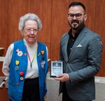 Michael Vela (right), executive director, San Antonio Red Cross Chapter, presents Gretchen Barrett with the Clara Barton Legacy Award for outstanding leadership and volunteerism during a ceremony March 7 at Brooke Army Medical Center. The 92-year-old began volunteering in 1958 in Stuttgart, Germany, and continued her volunteer career in San Antonio in 1969 at the Beach Pavilion on Fort Sam Houston.
