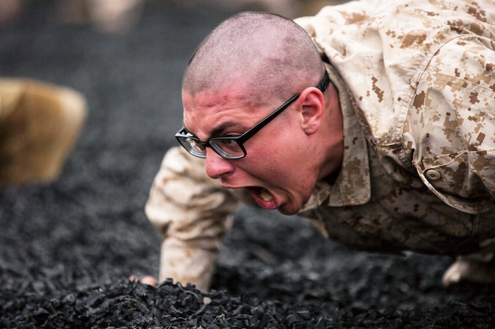 A recruit with Mike Company, 3rd Recruit Training Battalion, war-cries while conducting warm-ups during a Marine Corps Martial Arts Program training session at Marine Corps Recruit Depot San Diego, March 6.