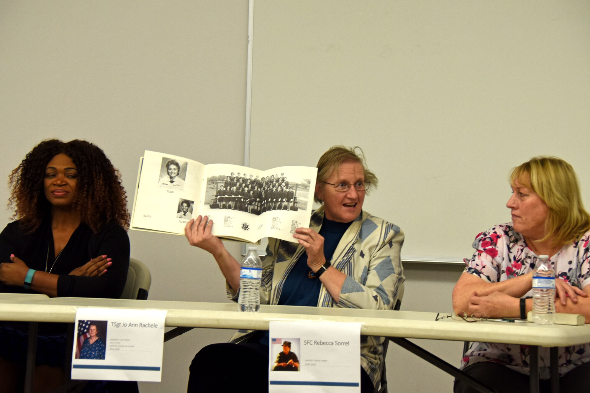 Jo Ann Rachele, retired member of Women in the Air Force, shows a picture of her graduating flight from basic military training in 1973 at the Service Through the Decades panel in honor of Women’s History Month at the Taylor Chapel on Goodfellow Air Force Base, Texas, March 8, 2019. Rachele continued to serve in the Air Force after WAF was decommissioned and the women were integrated into the Air Force. (U.S. Air Force photo by Senior Airman Seraiah Hines/Released)