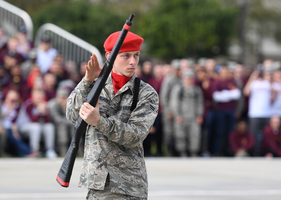 U.S. Air Force Airman 1st Class Ryan Sweazy, 336th Training Squadron freestyle drill master, performs during the 81st Training Group drill down on the Levitow Training Support Facility drill pad at Keesler Air Force Base, Mississippi, March 8, 2019. Airmen from the 81st TRG competed in a quarterly open ranks inspection, regulation drill routine and freestyle drill routine. Keesler trains more than 30,000 students each year. While in training, Airmen are given the opportunity to volunteer to learn and execute drill down routines. (U.S. Air Force photo by Kemberly Groue)