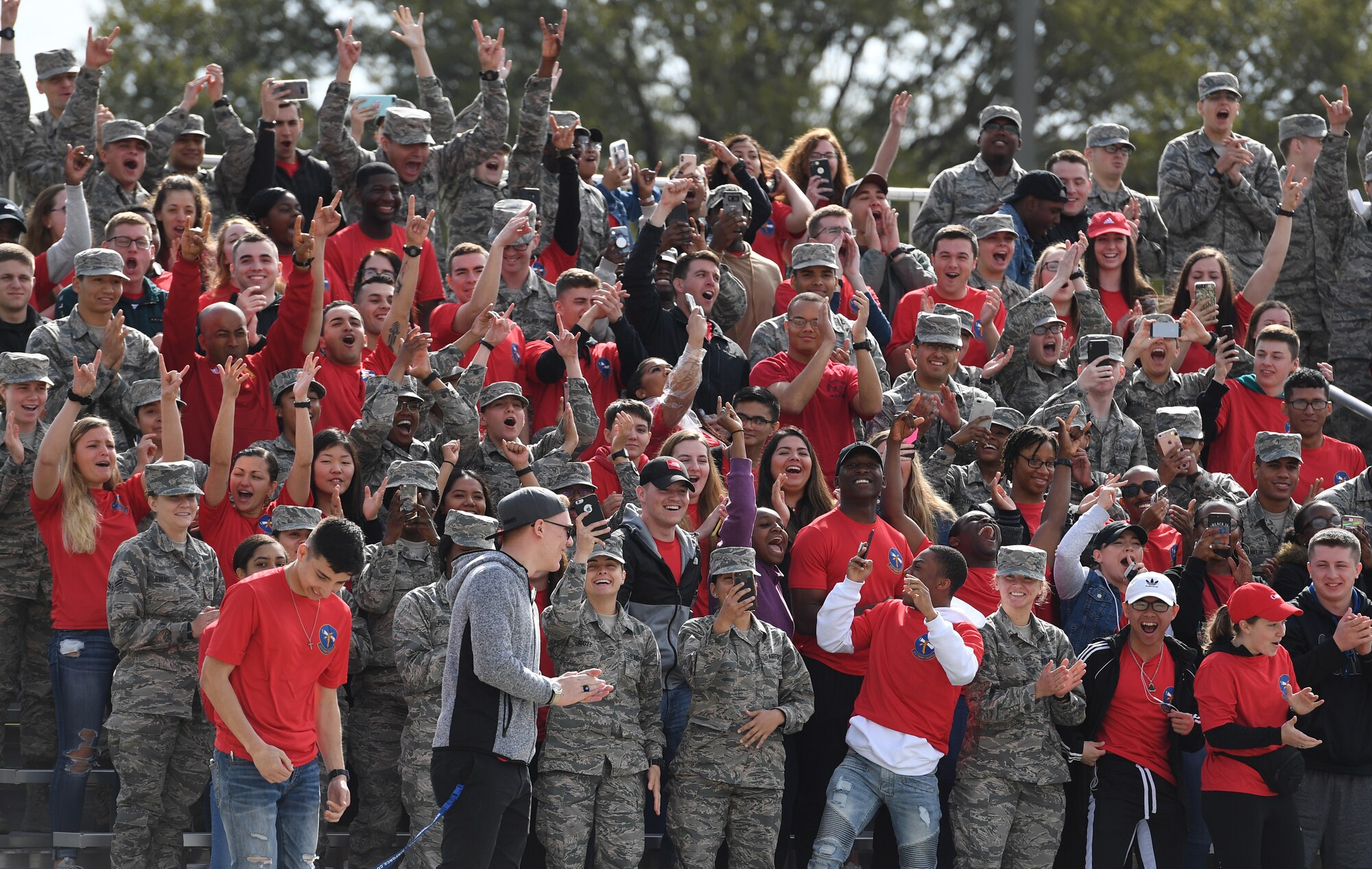 Members of the 335th Training Squadron cheer after winning the first place overall award during the 81st Training Group drill down on the Levitow Training Support Facility drill pad at Keesler Air Force Base, Mississippi, March 8, 2019. Airmen from the 81st TRG competed in a quarterly open ranks inspection, regulation drill routine and freestyle drill routine. Keesler trains more than 30,000 students each year. While in training, Airmen are given the opportunity to volunteer to learn and execute drill down routines. (U.S. Air Force photo by Kemberly Groue)