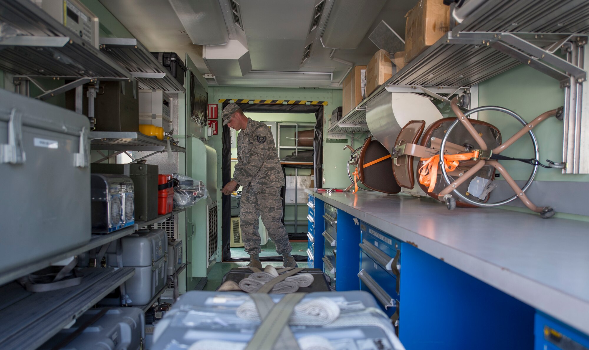 Tech. Sgt. Jaime Gardiner, a precision measurement equipment laboratory craftsman assigned 366th Component Maintenance Squadron at Mountain Home Air Force Base, Idaho, sets up a rapid assistance calibration lab on Joint Base Pearl Harbor-Hickam, Hawaii, Jan. 28, 2019. The RASCAL operates as a mobile PMEL module and can be sent out in support of overseas contingency operations. At JBPHH, the RASCAL will serve as the primary precision measurement equipment laboratory while renovations are underway at the current facility.  (U.S. Air Force photo by Tech. Sgt. Heather Redman)