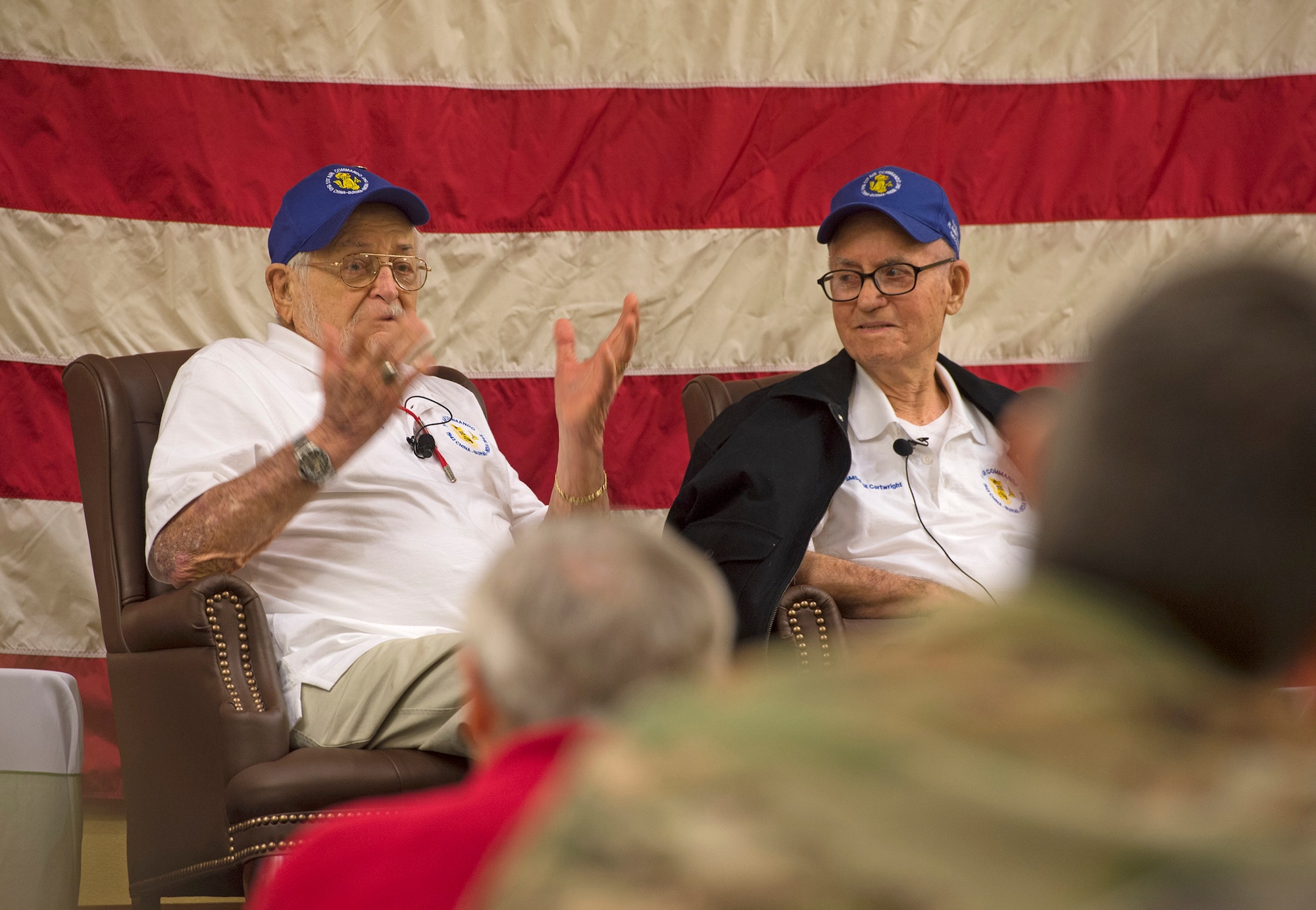 World War II veteran answers question alongside other veterans