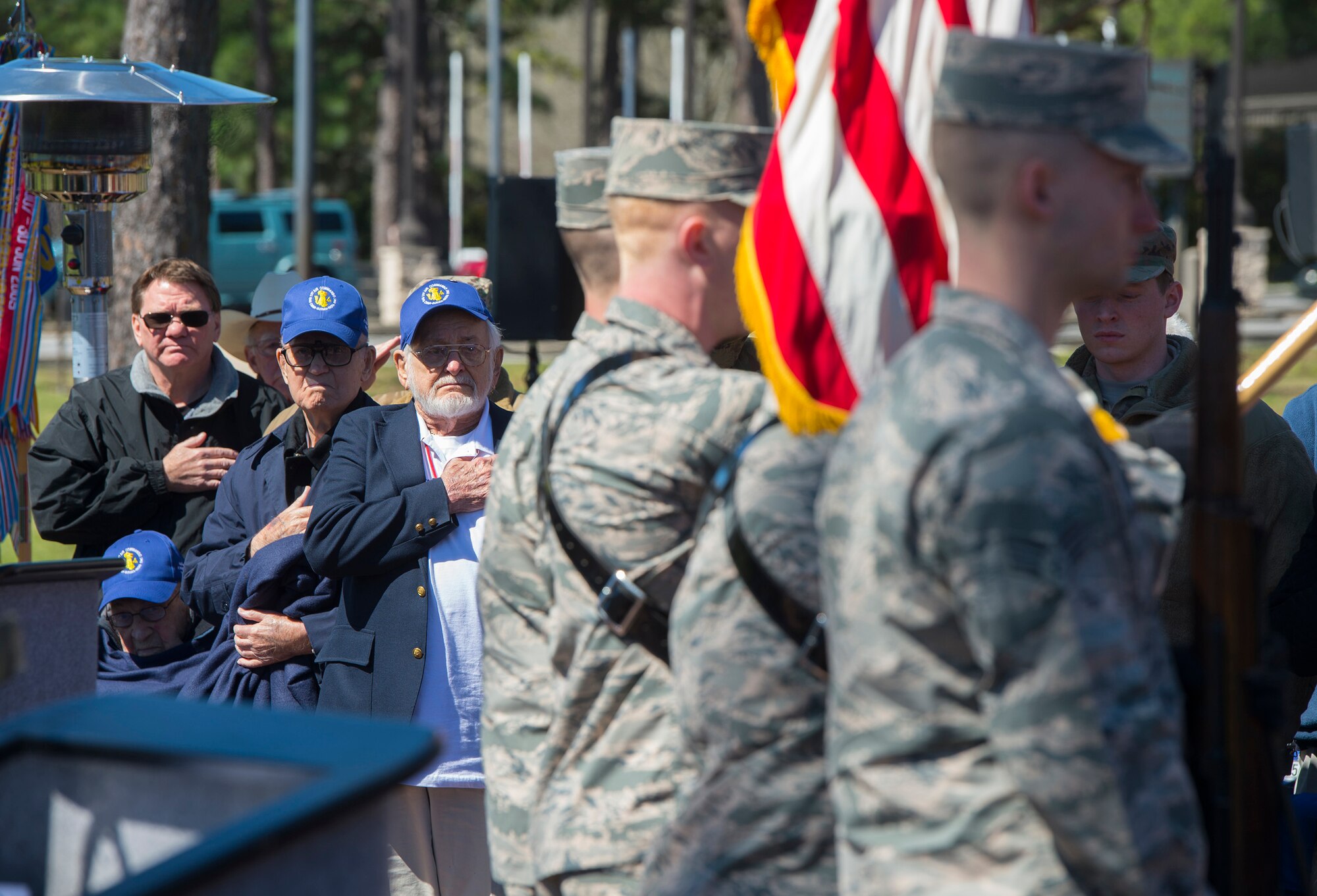 World War II veterans paying respects during color presentation