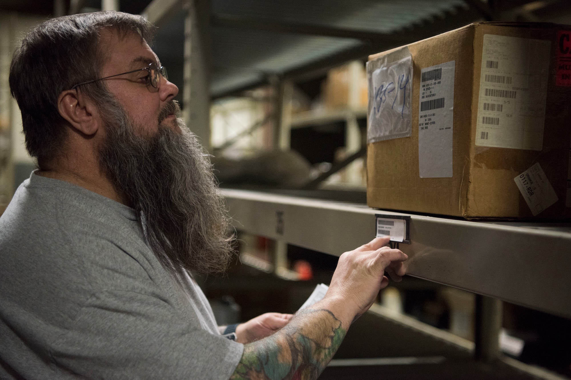 Tracey Try, a 673d Logistics Readiness Squadron storage and issue section materiel handler, pulls items for a shipment being created for the 176th Logistics Readiness Squadron March 11, 2019, at Joint Base Elmendorf-Richardson, Alaska. In one of the newest total force integration associations of its kind, the 673d LRS Materiel Management flight is conducting a complete C-17 aircraft supply turnover to the 176th LRS.