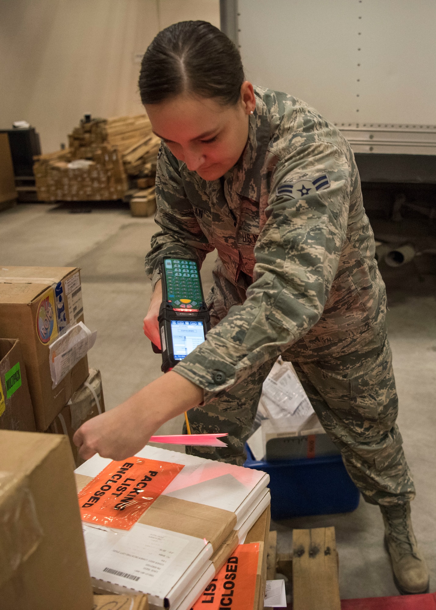 Alaska Air National Guard Airman 1st Class Lauren Scanlan, 176th Logistics Readiness Squadron ground transportation, scans a shipment order for delivery, March 11, 2019, at Joint Base Elmendorf-Richardson, Alaska. In one of the newest total force integration associations of its kind, the 673d Logistics Readiness Squadron Materiel Management flight is conducting a complete C-17 aircraft supply turnover to the Alaska ANG 176th LRS.