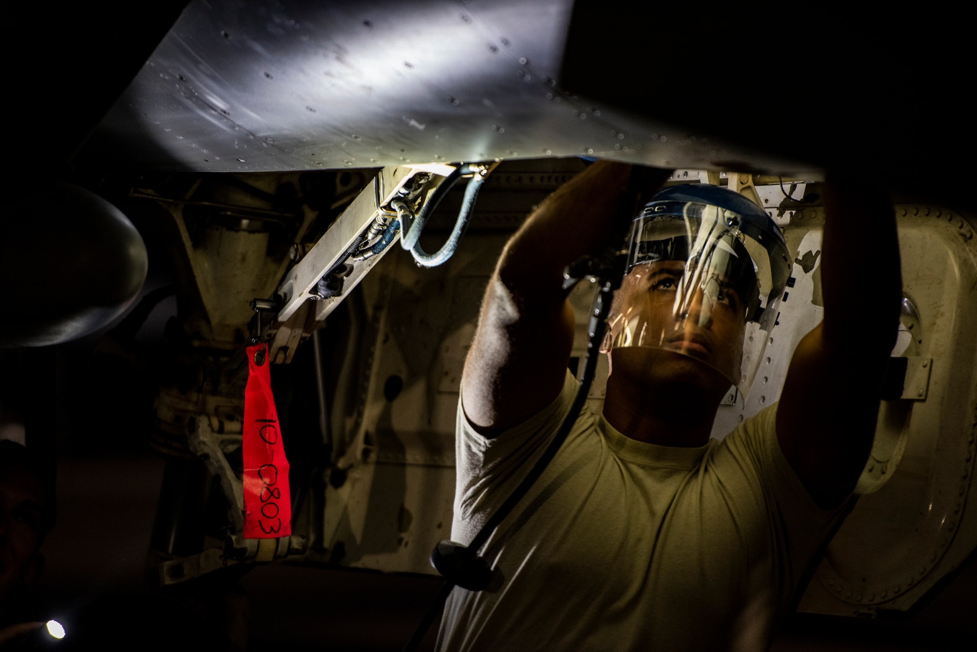 U.S. Air Force Staff Sgt. Josiah Baychu, 35th Aircraft Maintenance Squadron dedicated crew chief, services the emergency blowdown bottle during COPE Tiger 19 at Korat Royal Thai Air Force Base, Thailand, March 11, 2019.