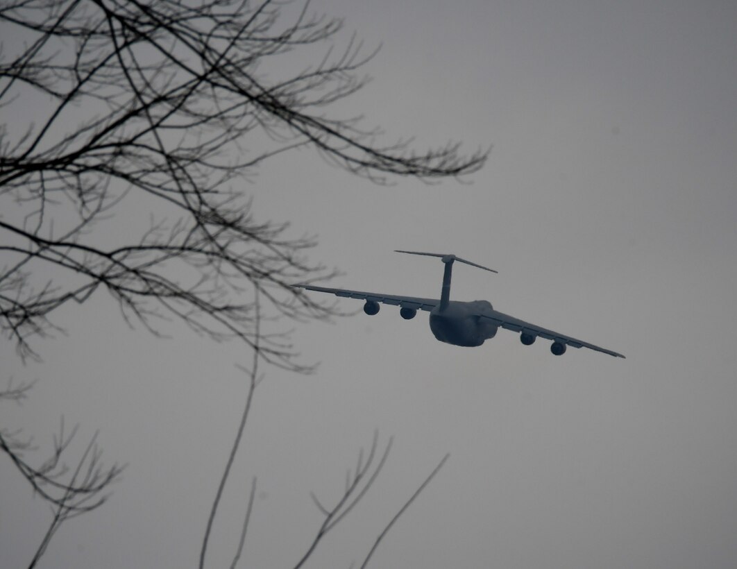 A C-5 aircraft makes a banking turn of approximately 15 degrees as it lifts off from training with the 932nd Airlift Wing March 2, 2019 at Scott Air Force Base, Illinois.  The 932nd Aeromedical Evacuation Squadron took part in a C-5M Super Galaxy patient evacuation training with the 142nd Aeromedical Evacuation Squadron, visiting from New Castle Air National Guard Base, Delaware, at Scott AFB, Illinois, March 2.

The training consisted of setting up litters on the back of seats and in the cargo hold. Only three AES’s have been certified in the C-5 patient evacuation training. C-5 training prepares units who are uncertified to do aeromedical evacuations and to be one step closer to completing the training. 

“Our prime aircrafts are C-130, KC-135 and C-17,” said Senior Master Sgt. Tonya Hupp, 932nd AES Operations Superintendent. “The C-5 is our opportune aircraft that we can move patients in the event that we are needed, if there were a mass casualty.”  (U.S. Air Force photo by Lt. Col. Stan Paregien)