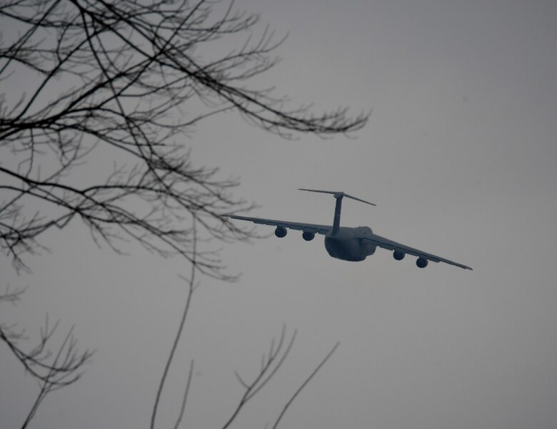 A C-5 aircraft makes a banking turn of approximately 15 degrees as it lifts off from training with the 932nd Airlift Wing March 2, 2019 at Scott Air Force Base, Illinois.  The 932nd Aeromedical Evacuation Squadron took part in a C-5M Super Galaxy patient evacuation training with the 142nd Aeromedical Evacuation Squadron, visiting from New Castle Air National Guard Base, Delaware, at Scott AFB, Illinois, March 2.

The training consisted of setting up litters on the back of seats and in the cargo hold. Only three AES’s have been certified in the C-5 patient evacuation training. C-5 training prepares units who are uncertified to do aeromedical evacuations and to be one step closer to completing the training. 

“Our prime aircrafts are C-130, KC-135 and C-17,” said Senior Master Sgt. Tonya Hupp, 932nd AES Operations Superintendent. “The C-5 is our opportune aircraft that we can move patients in the event that we are needed, if there were a mass casualty.”  (U.S. Air Force photo by Lt. Col. Stan Paregien)