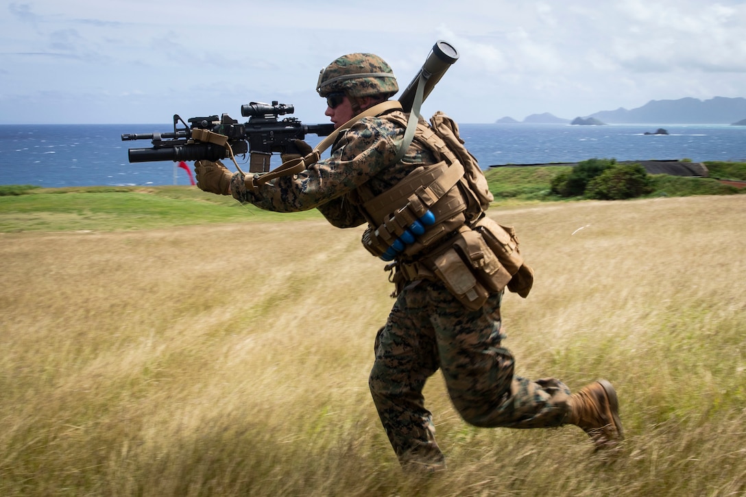 A U.S. Marine with Fox Company, 2nd Battalion, 3rd Marine Regiment, III Marine Expeditionary Force, charges toward a target during a squad supported attack at the Kaneohe Bay Range Training Facility, Marine Corps Base Hawaii, March 5, 2019.