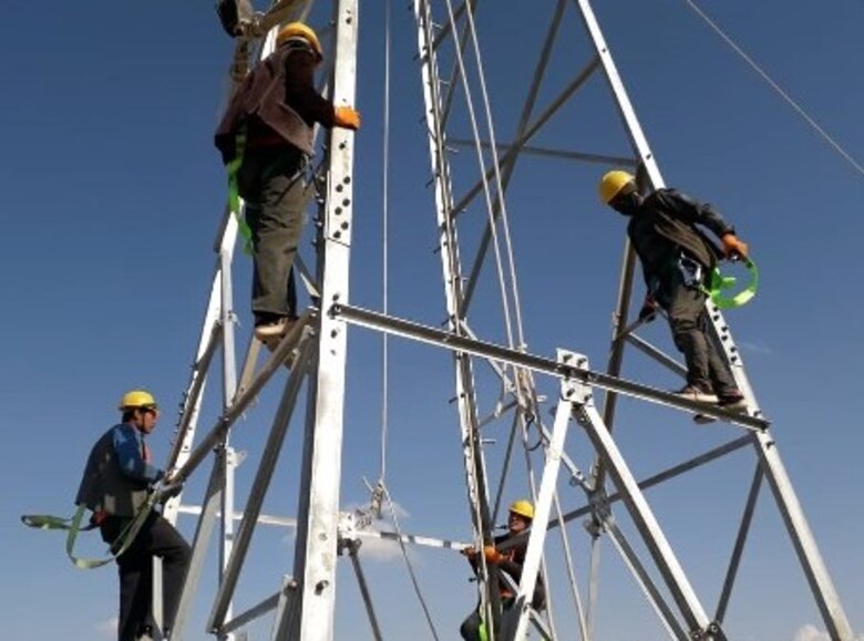Erection of steel structure of 15 kV 209th Garrison distribution line tower in progress.