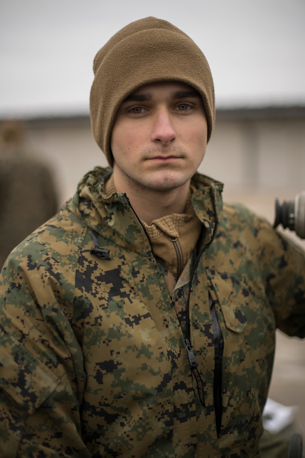 Pfc. Alexander Holloway, a cannoneer with Hotel Battery, 3rd Battalion, 14th Marine Regiment, 4th Marine Division poses for a picture at an Adazi Training Area, Latvia, Feb. 26, 2019, during exercise Dynamic Front 19. DF19 is a multinational exercise designed to improve allied and partner nation ability to deliver long-range fires capabilities. (U.S. Marine Corps photo by Cpl. Niles Lee)