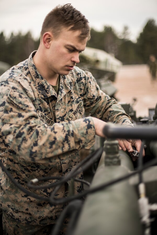 Sgt. Michael Gantvoort, an artillery maintenance chief attached to Hotel Battery, 3rd Battalion, 14th Marine Regiment, 4th Marine Division, inspects a M777 howitzer at Adazi Training Area, Latvia, Feb. 27, 2019, during exercise Dynamic Front 19. Exercise Dynamic Front 19 includes approximately 3,200 service members from 27 nations who are observing or participating from Grafenwoehr Training Area, Germany; Riga, Latvia; and Torun, Poland; during March 2-9, 2019. Dynamic Front is an annual U.S. Army Europe exercise focused on the readiness and interoperability of U.S. Army, joint service, and allied and partner nations’ artillery and fire support working together in a multinational environment. (U.S. Marine Corps photo by Cpl. Niles Lee)