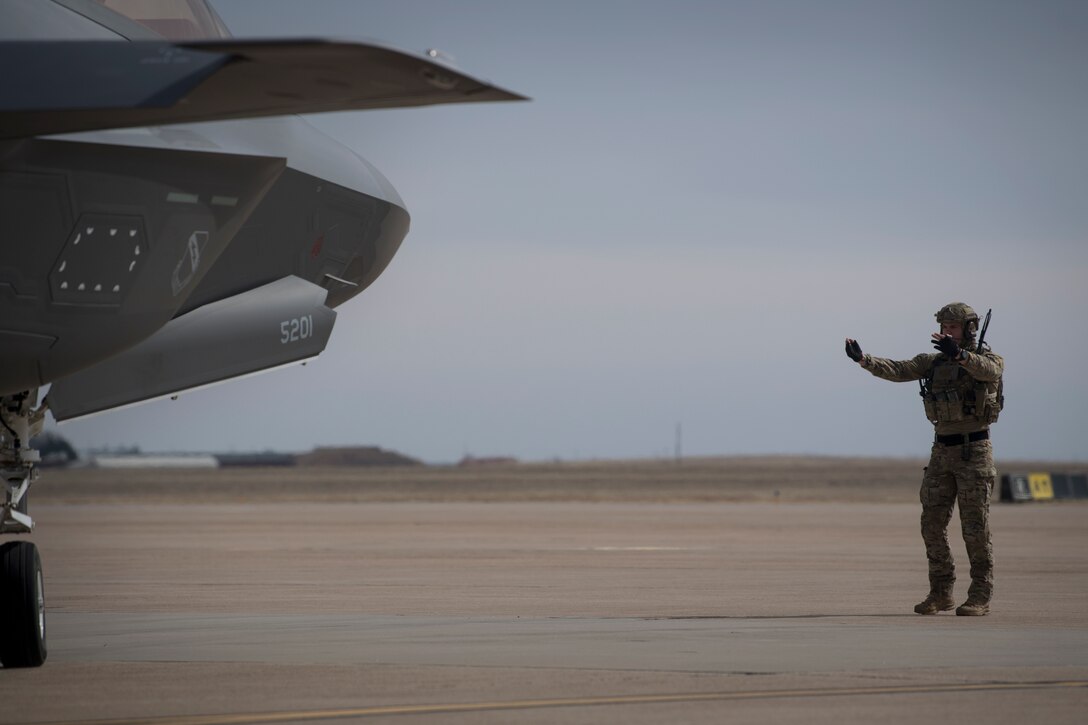 Airmen from the 388th Fighter Wing at Hill Air Force Base, Utah, and Air Commandos from the 26th Special Tactics Squadron and the 27th Special Operation Logistics Readiness Squadron conduct a forward area refueling point from an MC-130J Commando II to an F-35A Lightning II at Cannon AFB, N.M., Feb. 27, 2018.