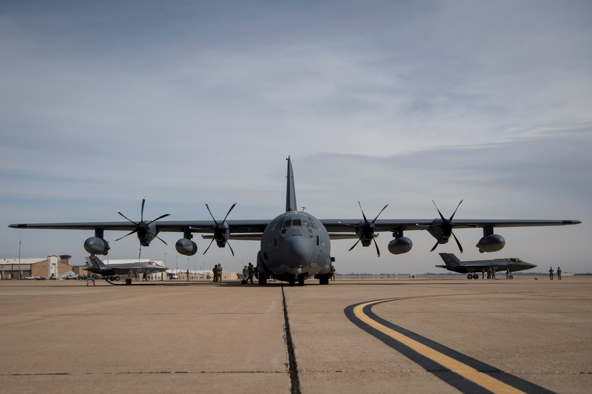 Airmen from the 388th Fighter Wing at Hill Air Force Base, Utah, and Air Commandos from the 26th Special Tactics Squadron and the 27th Special Operation Logistics Readiness Squadron conduct a forward area refueling point from an MC-130J Commando II to an F-35A Lightning II at Cannon AFB, N.M., Feb. 27, 2018.