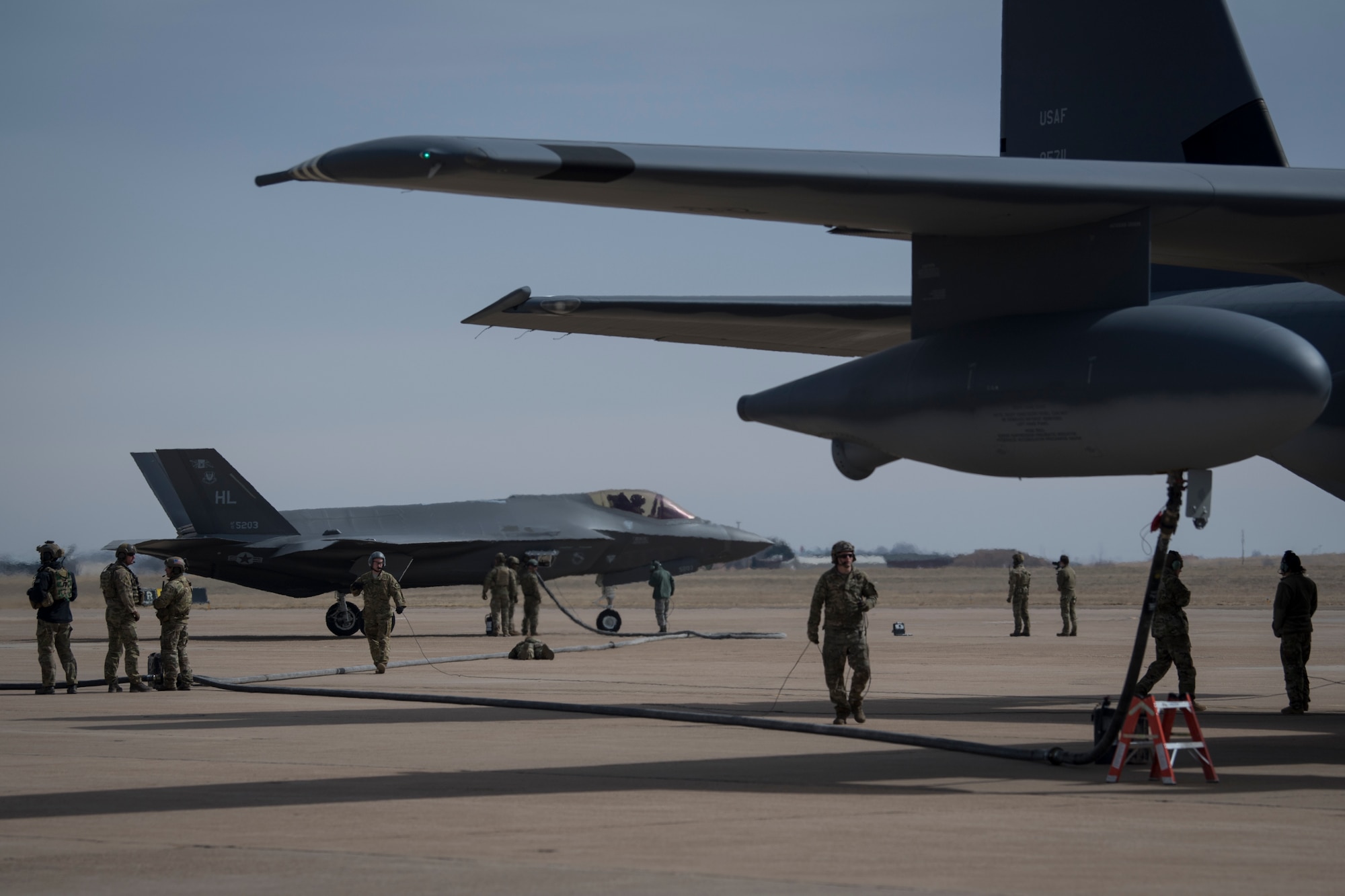 Airmen from the 388th Fighter Wing at Hill Air Force Base, Utah, and Air Commandos from the 26th Special Tactics Squadron and the 27th Special Operation Logistics Readiness Squadron conduct a forward area refueling point from an MC-130J Commando II to an F-35A Lightning II at Cannon AFB, N.M., Feb. 27, 2018.