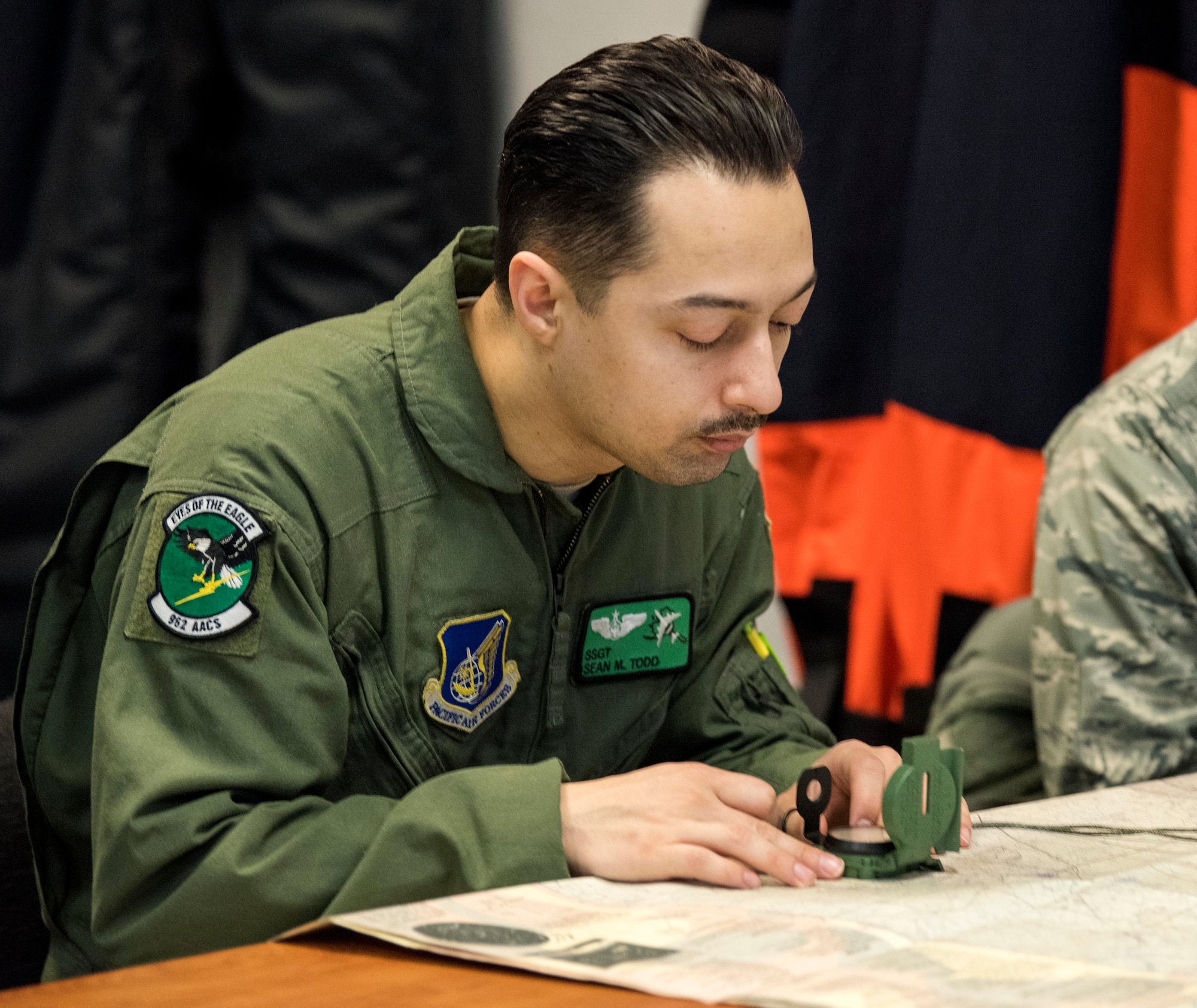 U.S. Air Force Staff Sgt. Sean Todd, 962nd Airborne Air Control Squadron computer display maintenance technician, uses a lensatic compass during a Survival, Evasion, Resistance and Combat Survival Training course at Joint Base Elmendorf-Richardson, Alaska, March, 7, 2019. Combat Survival Training is the SERE refresher course for high-risk personnel to get reacquainted with some of the skills they learned during the extensive S-V-80A course at Fairchild Air Force Base in Spokane, Washington.