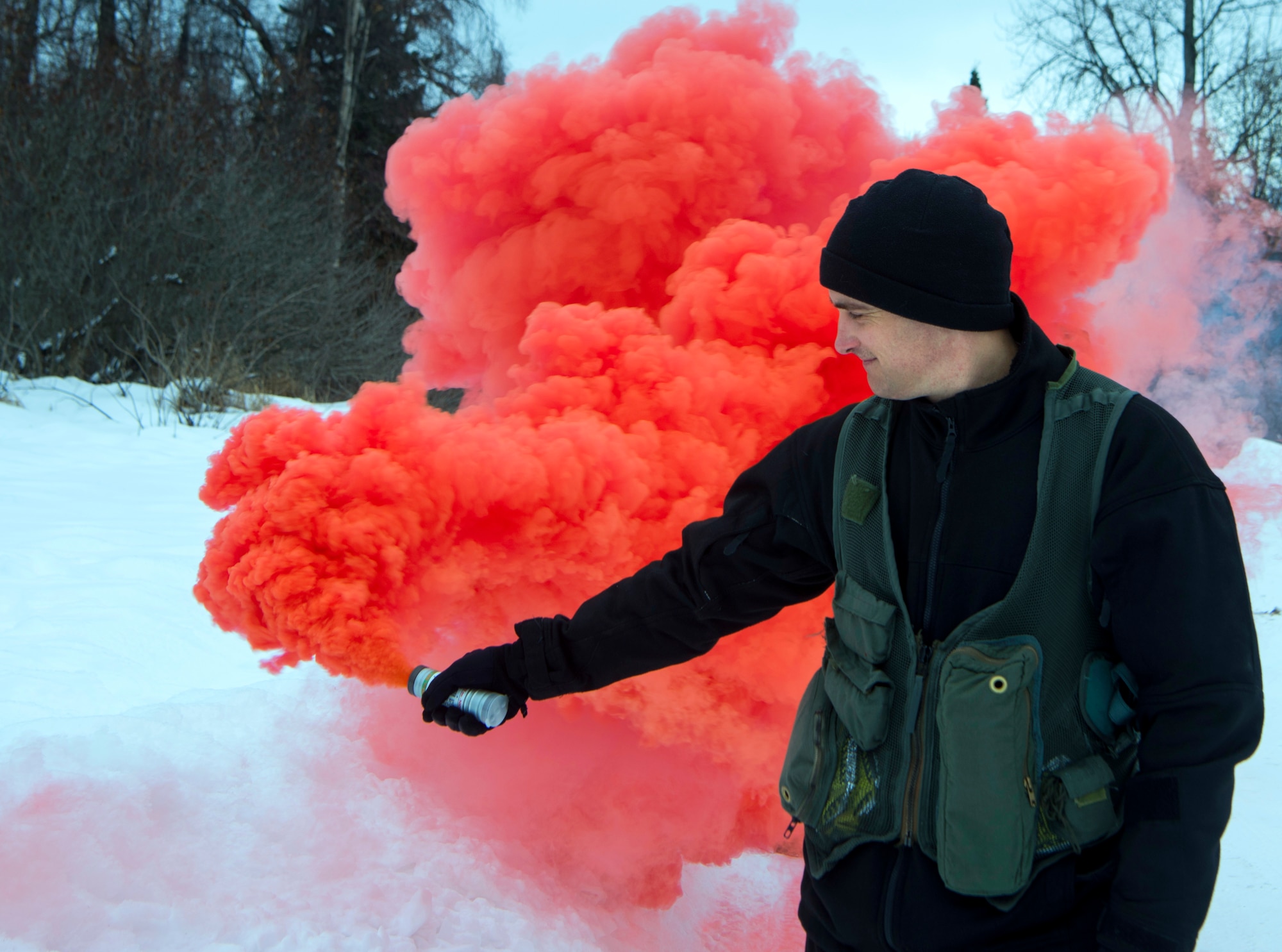 U.S. Air Force Lt. Col. Henry Schantz, 525th Fighter Squadron commander, uses a signal flare during a Survival, Evasion, Resistance and Escape Combat Survival Training course at Joint Base Elmendorf-Richardson, Alaska, March, 7, 2019. Combat Survival Training is the SERE refresher course for high-risk personnel to get reacquainted with some of the skills they learned during the extensive S-V-80A course at Fairchild Air Force Base in Spokane, Washington.
