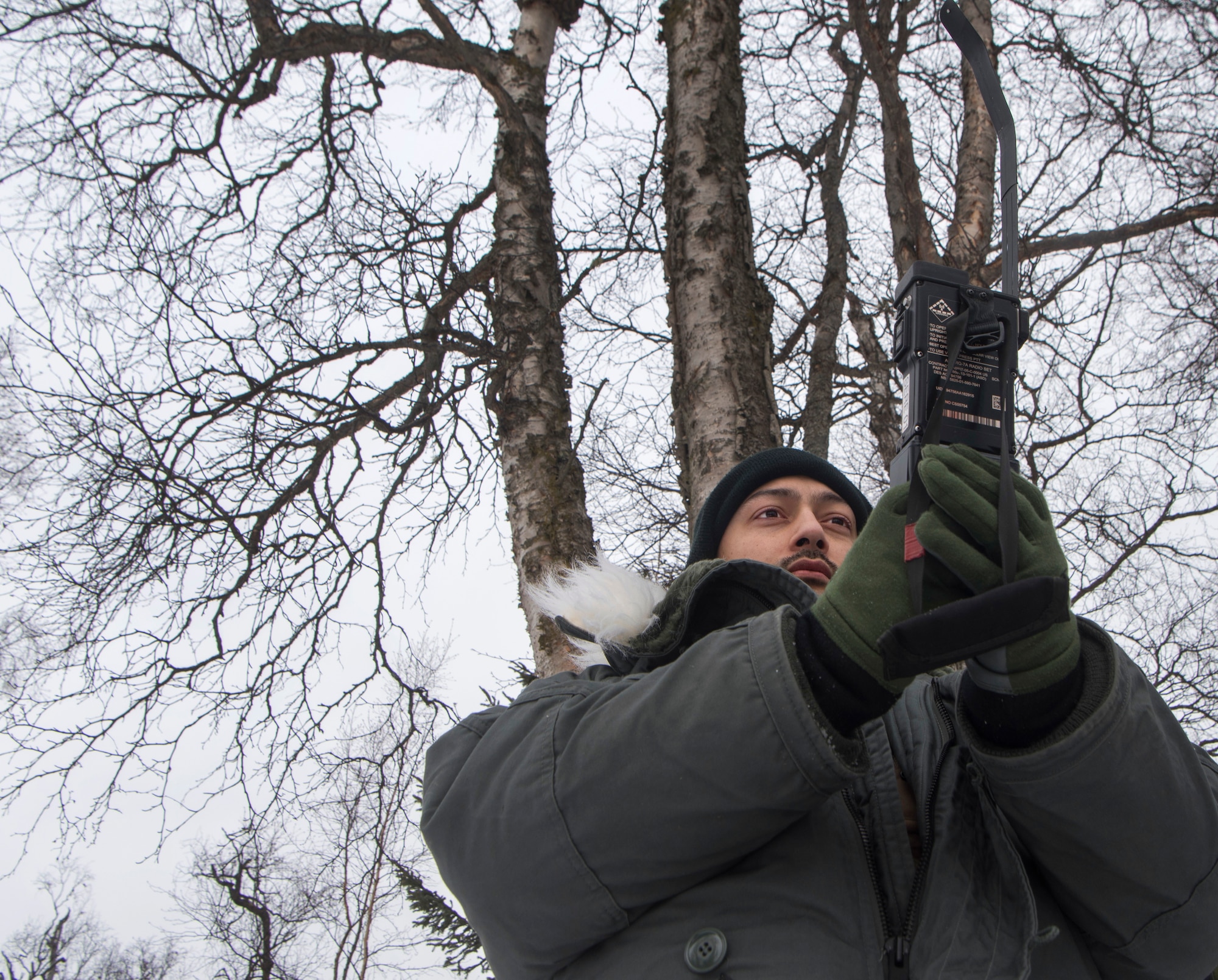 U.S. Air Force Staff Sgt. Sean Todd, 962nd Airborne Air Control Squadron computer display maintenance technician, configures a combat survival evader locator radio during a Survival, Evasion, Resistance and Escape Combat Survival Training course at Joint Base Elmendorf-Richardson, Alaska, March, 7, 2019. Combat Survival Training is the SERE refresher course for high-risk personnel to get reacquainted with some of the skills they learned during the extensive S-V-80A course at Fairchild Air Force Base in Spokane, Washington.