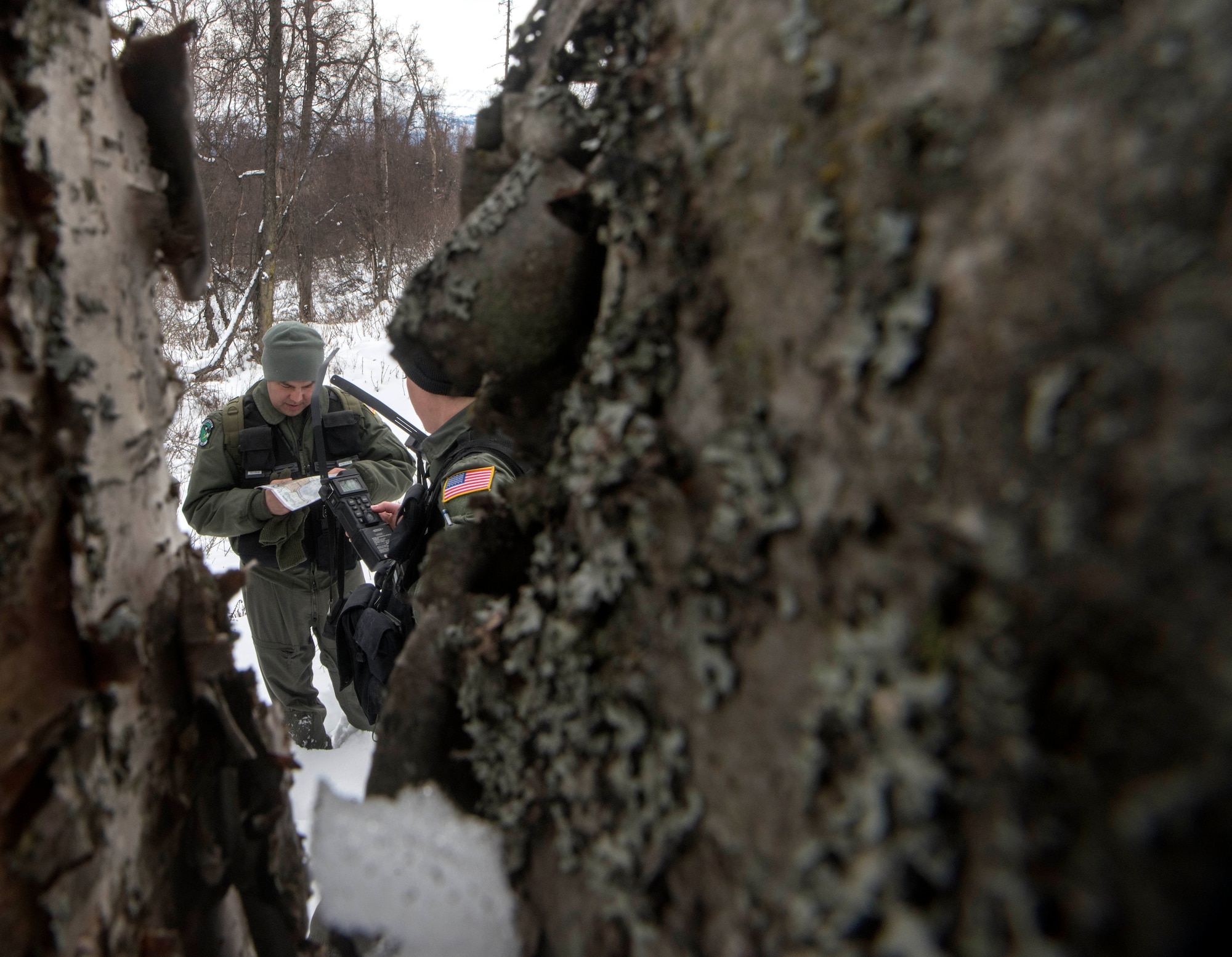 U.S. Air Force Tech. Sgt. Michael Banks, 962nd Airborne Air Control Squadron flight engineer, analyzes an evasion chart during a Survival, Evasion, Resistance and Escape Combat Survival Training course at Joint Base Elmendorf-Richardson, Alaska, March, 7, 2019. Combat Survival Training is the SERE refresher course for high-risk personnel to get reacquainted with some of the skills they learned during the extensive S-V-80A course at Fairchild Air Force Base in Spokane, Washington.