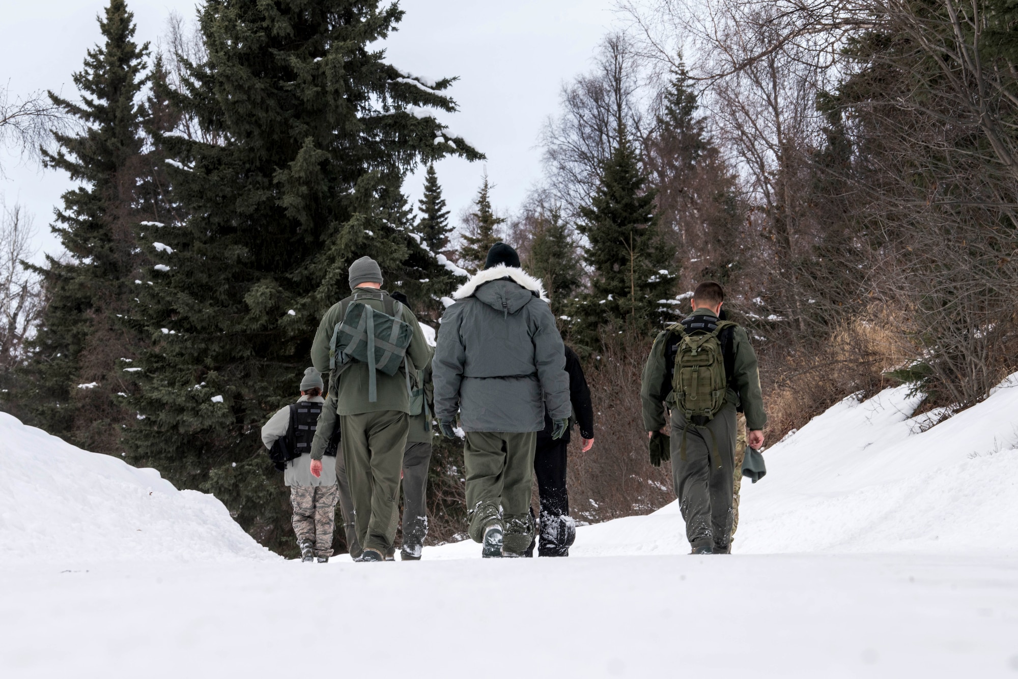 Combat Survival Training students finish a Survival, Evasion, Resistance and Escape course at Joint Base Elmendorf-Richardson, Alaska, March, 7, 2019. Combat Survival Training is the SERE refresher course for high-risk personnel to get reacquainted with some of the skills they learned during the extensive S-V-80A course at Fairchild Air Force Base in Spokane, Washington.
