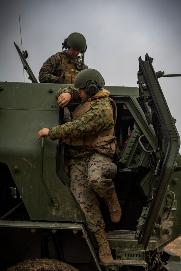 U.S. Marines with Fox Battery, 2nd Battalion, 14th Marine Regiment, 4th Marine Division, exit a High Mobility Artillery Rocket System during live-fire training at Adazi Training Area, Latvia, March 7, 2019, in support of exercise Dynamic Front 19. Exercise Dynamic Front 19 includes approximately 3,200 service members from 27 nations who are observing or participating from Grafenwoehr Training Area, Germany; Riga, Latvia; and Torun, Poland; during March 2-9, 2019. Dynamic Front is an annual U.S. Army Europe exercise focused on the readiness and interoperability of U.S. Army, joint service, and allied and partner nations’ artillery and fire support working together in a multinational environment.  (U.S. Marine Corps photo by Sgt. Andy O. Martinez)