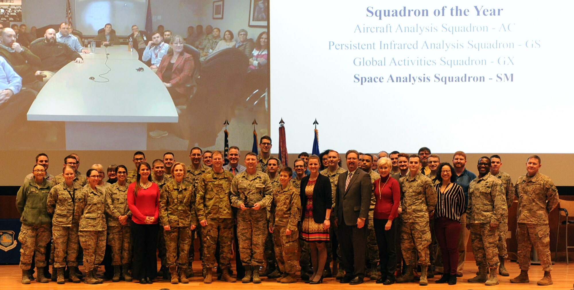 Lt. Gen. VeraLinn “Dash” Jamieson, Deputy Chief of Staff for Intelligence, Surveillance, and Reconnaissance and Cyber Effects, and Col. Parker Wright, National Air and Space Intelligence Center commander, recognize the Space Analysis Squadron as the NASIC squadron of the year, Feb. 27, 2019. Jamieson recognized the winners and nominees at NASICs annual award ceremony, during her visit to Wright-Patterson Air Force Base. (U.S. Air Force photo by Senior Airman Samuel Earick)