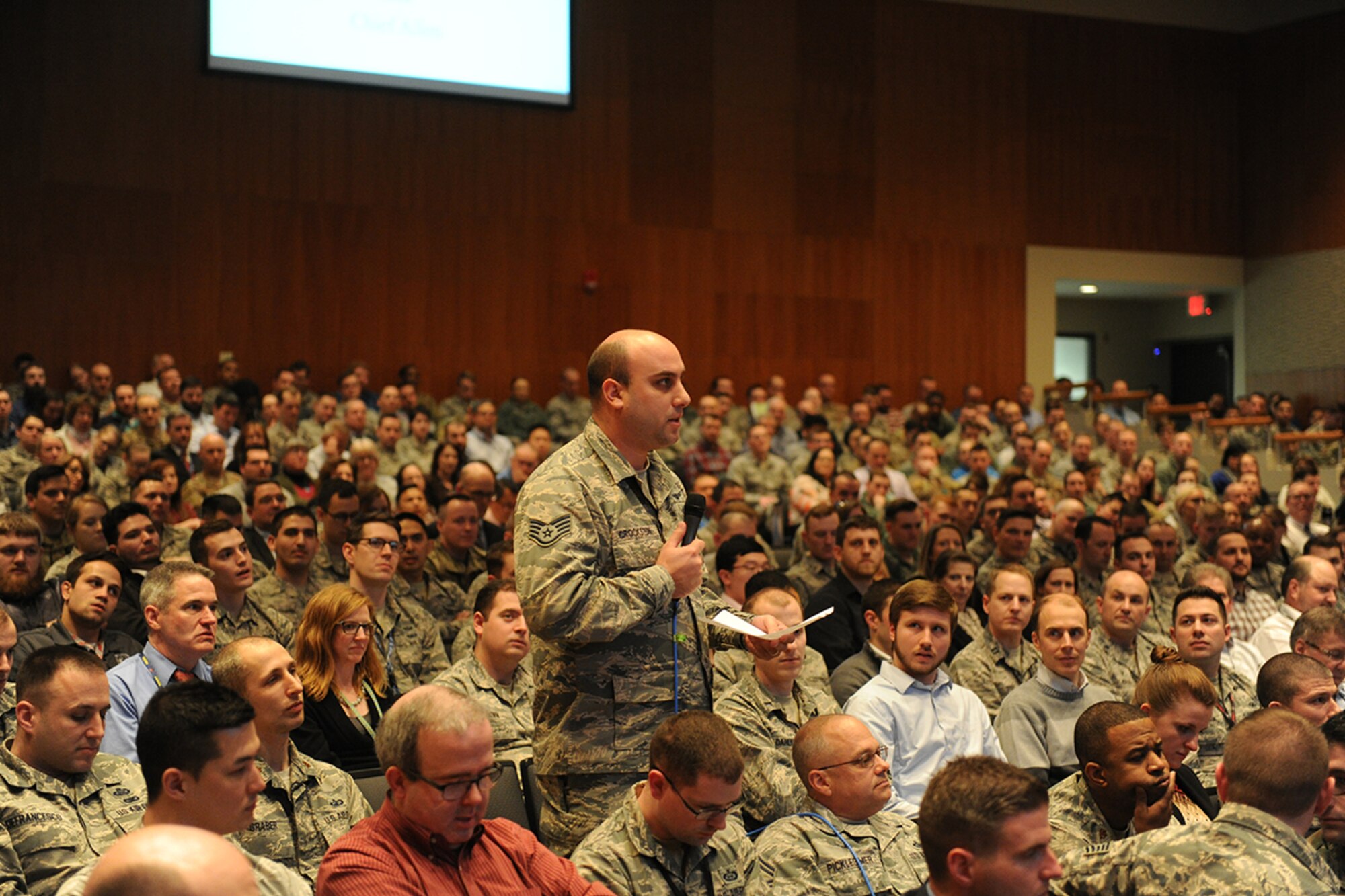 Staff Sgt. Conrad Crookston, Air and Cyberspace Intelligence Group, asks Lt. Gen. VeraLinn “Dash” Jamieson a question during a town hall meeting at the National Air and Space Intelligence Center Feb. 27, 2019. Jamieson, the Air Force Deputy Chief of Staff for Intelligence, Surveillance, Reconnaissance and Cyber Effects, visited the Center Feb. 26-28. (U.S. Air Force photo by Senior Airman Samuel Earick)