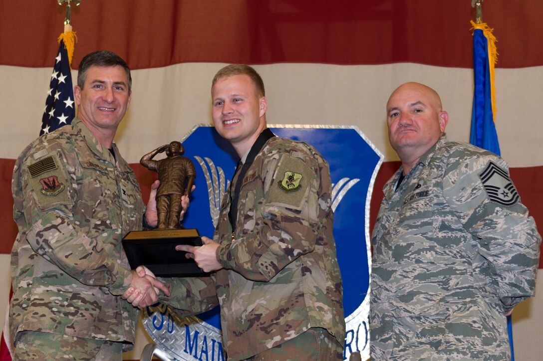 Senior Airman Robert Miller, 23d Maintenance Group, wins Airman Plans and Scheduling Professional of the Year, March 8, 2019, at Moody Air Force Base, Ga. Maintenance Professional of the Year (MPOY) is a long-running tradition in the maintenance career field. MPOY is a ceremony that highlights that year's top performing Airmen. (U.S. Air Force photo by Airman 1st Class Hayden Legg)