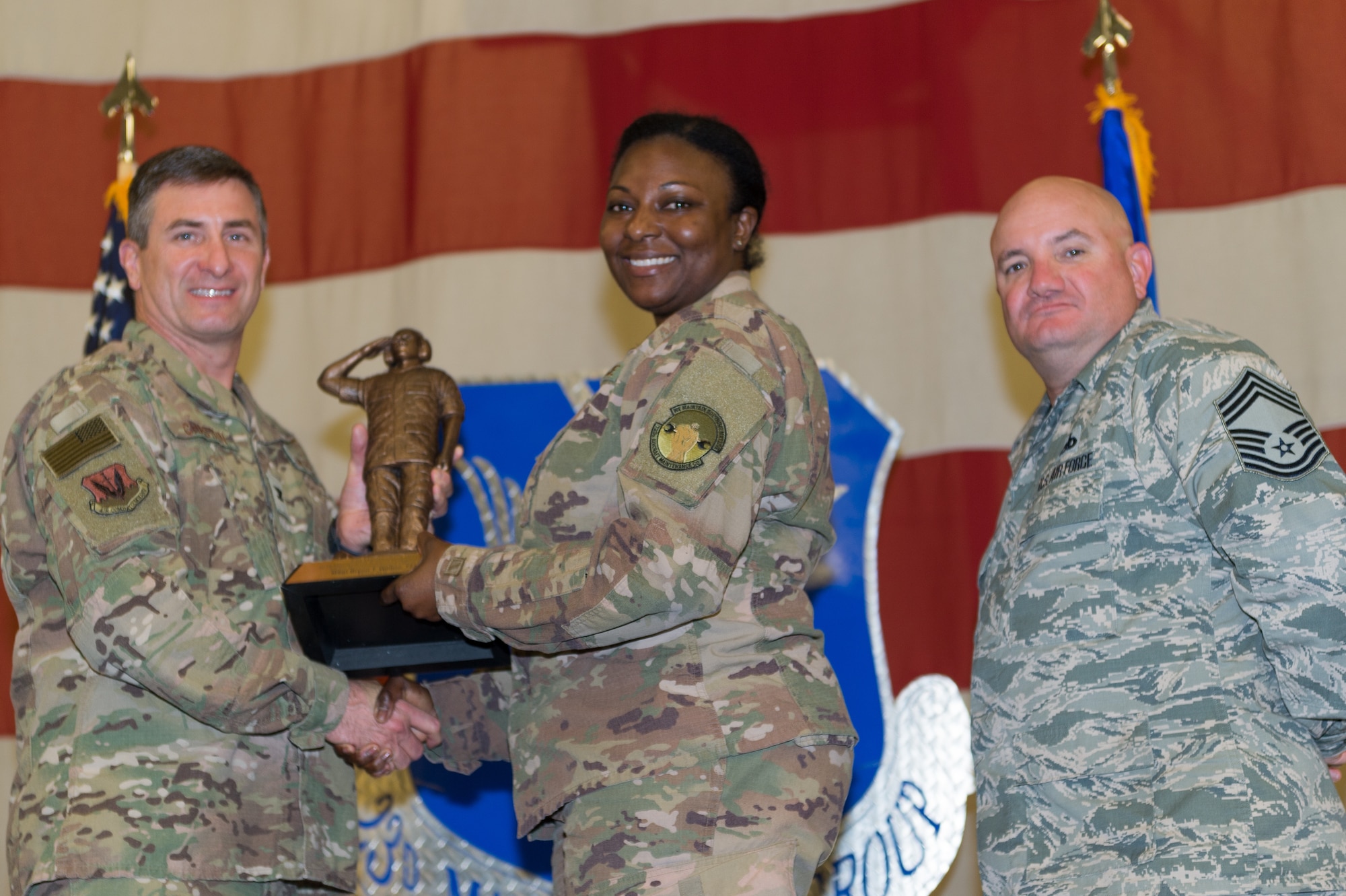 Lt. Col. Redahlia Person, 723d Aircraft Maintenance Squadron (AMXS), accepts Senior NCO Maintenance Support Professional of the Year on behalf of Master Sgt. Bryon Walton, 723d AMXS, March 8, 2019, at Moody Air Force Base, Ga. Maintenance Professional of the Year (MPOY) is a long-running tradition in the maintenance career field. MPOY is a ceremony that highlights that year's top performing Airmen. (U.S. Air Force photo by Airman 1st Class Hayden Legg)