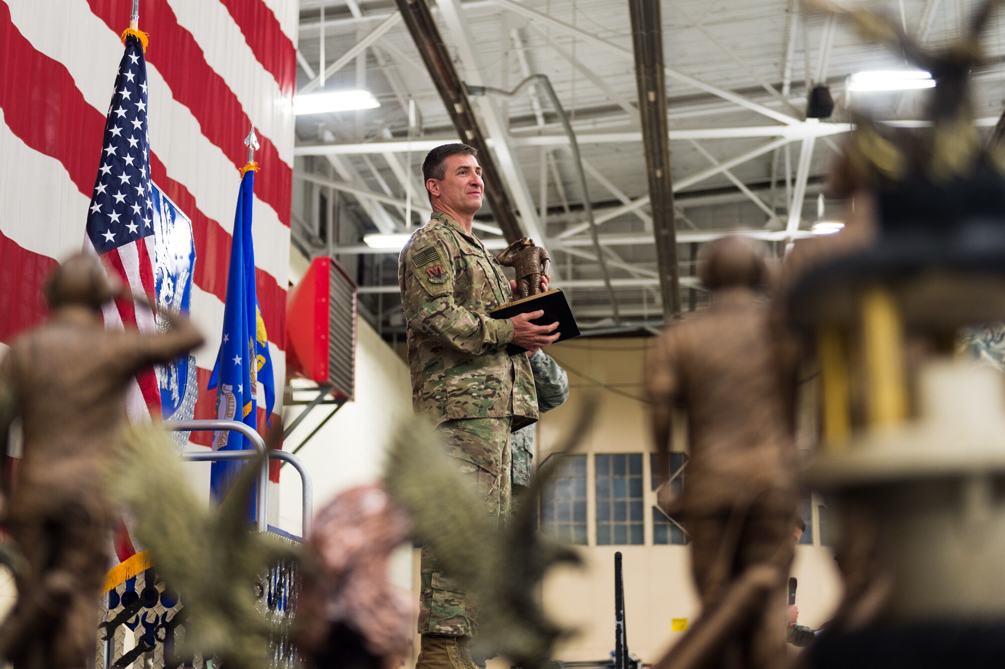 Col. John Chastain, 23d Maintenance Group commander, holds an award, March 8, 2019, at Moody Air Force Base, Ga. Maintenance Professional of the Year is a long-running tradition in the maintenance career field. MPOY is a ceremony that highlights that year's top performing Airmen. (U.S. Air Force photo by Airman 1st Class Hayden Legg)