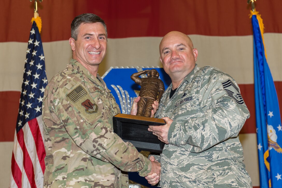 Chief Master Sgt. Brian Preyna, 23d Maintenance Group (MXG), wins an award for his contributions to the 23d MXG, March 8, 2019, at Moody Air Force Base, Ga. Maintenance Professional of the Year (MPOY) is a long-running tradition in the maintenance career field. MPOY is a ceremony that highlights that year's top performing Airmen. (U.S. Air Force photo by Airman 1st Class Hayden Legg)