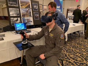First Lt. Spencer Teiken from the 80th Operational Support Squadron at Sheppard Air Force Base, Texas, works through a virtual simulation problem during the Pilot Training Next Technology Expo at Joint Base San Antonio-Randolph, Texas, March 12, 2019. Technology currently being used at PTN was on display at the expo and subject matter experts and technology vendors were available to talk with attendees. (U.S. Air Force photo by Dan Hawkins)