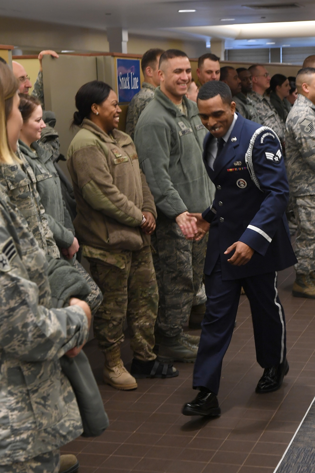 Senior Airman Joseph Dukes, knowledge operations manager with the 911th Communications Squadron, is congratulated by fellow Airmen after being awarded 911th Airlift Wing Base Honor Guardsman of the Year at the Pittsburgh International Airport Air Reserve Station, Pemmsylvania., March 2, 2019. Airmen gathered to formally recognize their peers at the 2019 911th AW Awards Ceremony. (U.S. Air Force photo by Senior Airman James Fritz)