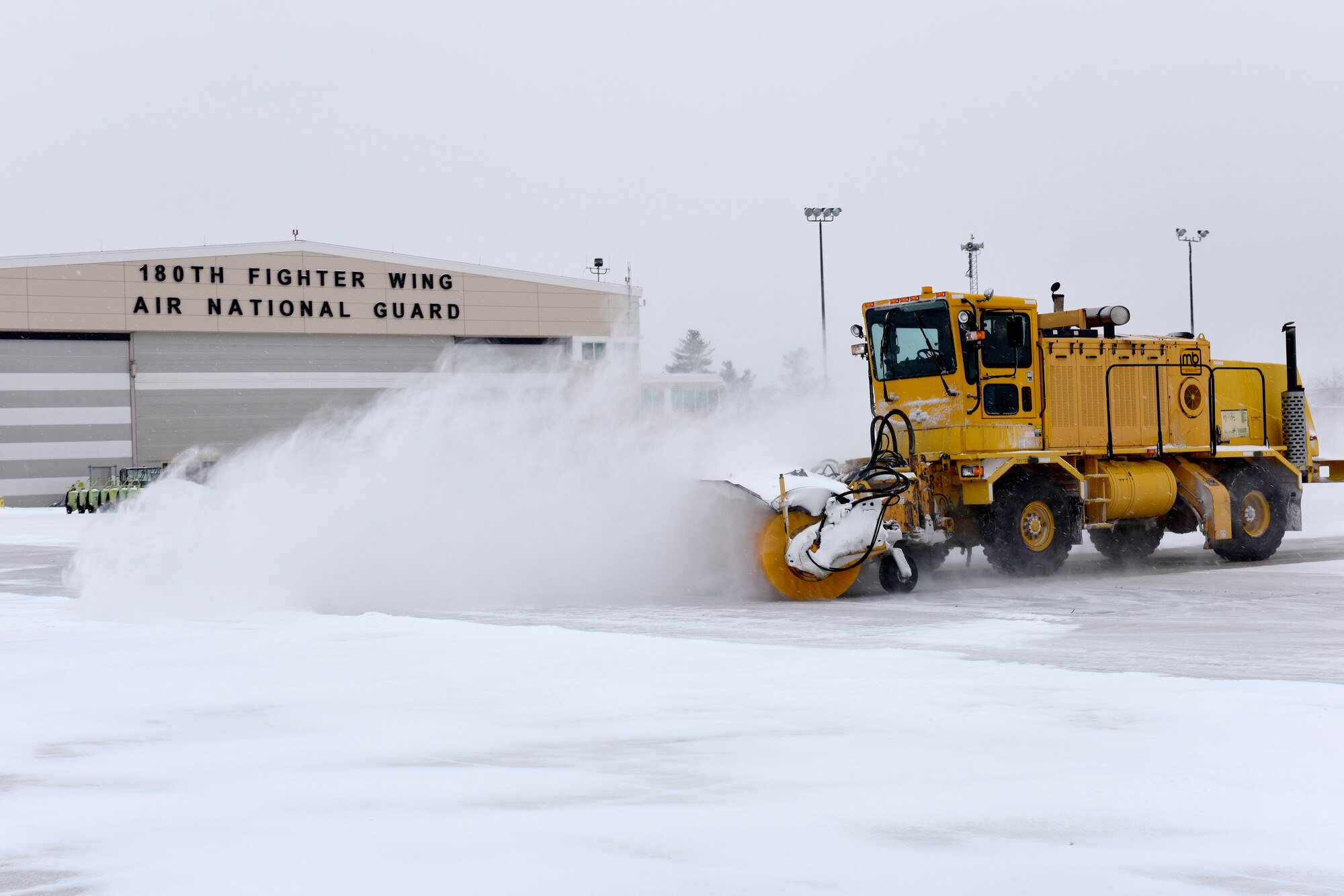 Heavy equipment removes snow and ice from the roads at the 180th Fighter Wing, Ohio Air National Guard during a polar vortex Jan. 28, 2019. Snow removal is a critical aspect of ensuring the 180FW can continue its mission, even in the worst weather conditions. (U.S. Air National Guard photo by Staff Sgt. Shane Hughes)