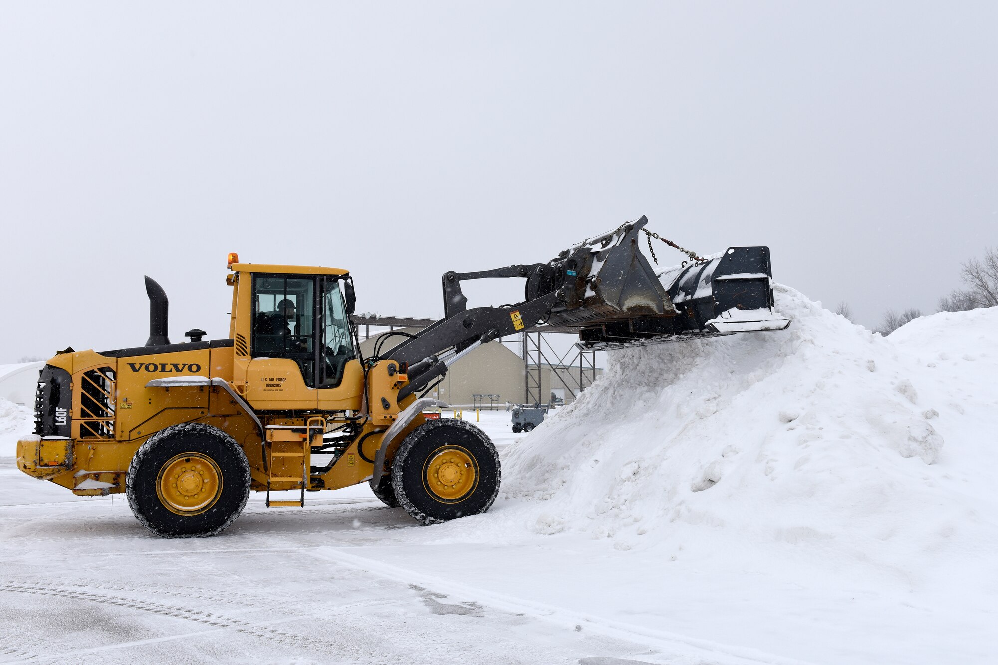 Heavy equipment removes snow and ice from the roads at the 180th Fighter Wing, Ohio Air National Guard during a polar vortex Jan. 28, 2019. Snow removal is a critical aspect of ensuring the 180FW homeland defense mission is always ready to respond to the nation's call. (U.S. Air National Guard photo by Staff Sgt. Shane Hughes)