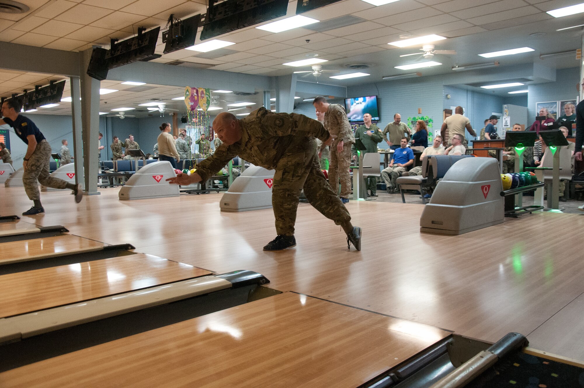 Col. Matthew Dillow, 20th Air Force vice commander, bowls at the F. E. Warren bowling alley on F. E. Warren AFB, Wyo. March 8, 2019. 20th Air Force headquarters staff organized a bowling tournament in honor of the 75th anniversary of 20th Air Force. (U.S. Air Force photo by 1st Lt Ieva Bytautaite)