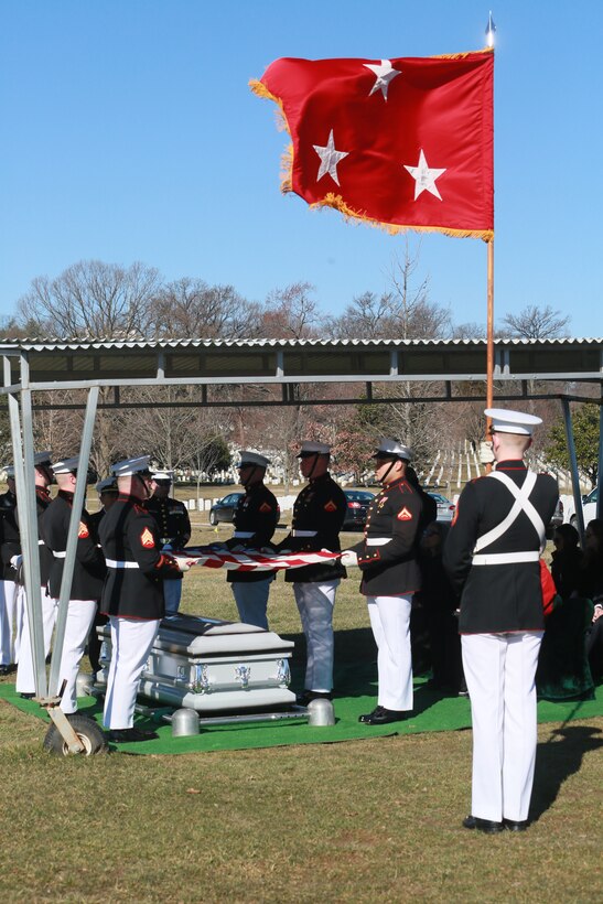 Corporal Adam Sweckard, Marine Corps Color Guard, Marine Barracks Washington D.C., bears a general officer flag during a full honors funeral for Lt. Gen. Leo Dulacki at Arlington National Cemetery, Arlington, Virginia, March 13, 2019. Dulacki enlisted in the Marine Corps in 1941 and received his commission as a second lieutenant on Sept. 2, 1941. During his 32 years of service, Dulacki fought in World War II, Korea and Vietnam; he retired in January 1974. His personal decorations included the Distinguished Service Medal with a gold star, Legion of Merit with a combat distinguishing device for valor with three gold stars, and the Purple Heart. Dulacki passed away on Jan. 4, 2019 six days after his 100th birthday. (U.S. Marine Corps photo by Sgt. Robert Knapp/Released)