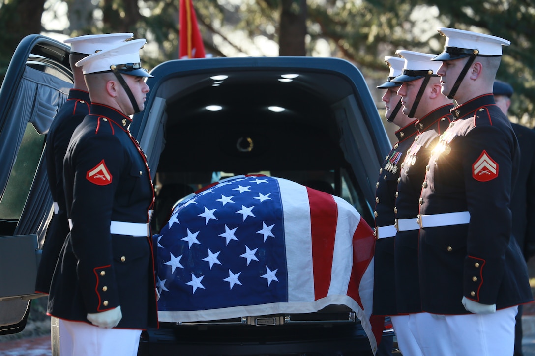 Marine Corps Body Bearers, Bravo Company, Marine Barracks Washington D.C., stand at the position of attention during a full honors funeral for Lt. Gen. Leo Dulacki at Arlington National Cemetery, Arlington, Virginia, March 13, 2019. Dulacki enlisted in the Marine Corps in 1941 and received his commission as a second lieutenant Sept. 2, 1941. During his 32 years of service, Dulacki fought in World War II, Korea and Vietnam; he retired in January 1974. His personal decorations included the Distinguished Service Medal with a gold star, Legion of Merit with a combat distinguishing device for valor with three gold stars, and the Purple Heart. Dulacki passed away on Jan. 4, 2019 six days after his 100th birthday. (U.S. Marine Corps photo by Sgt. Robert Knapp/Released)