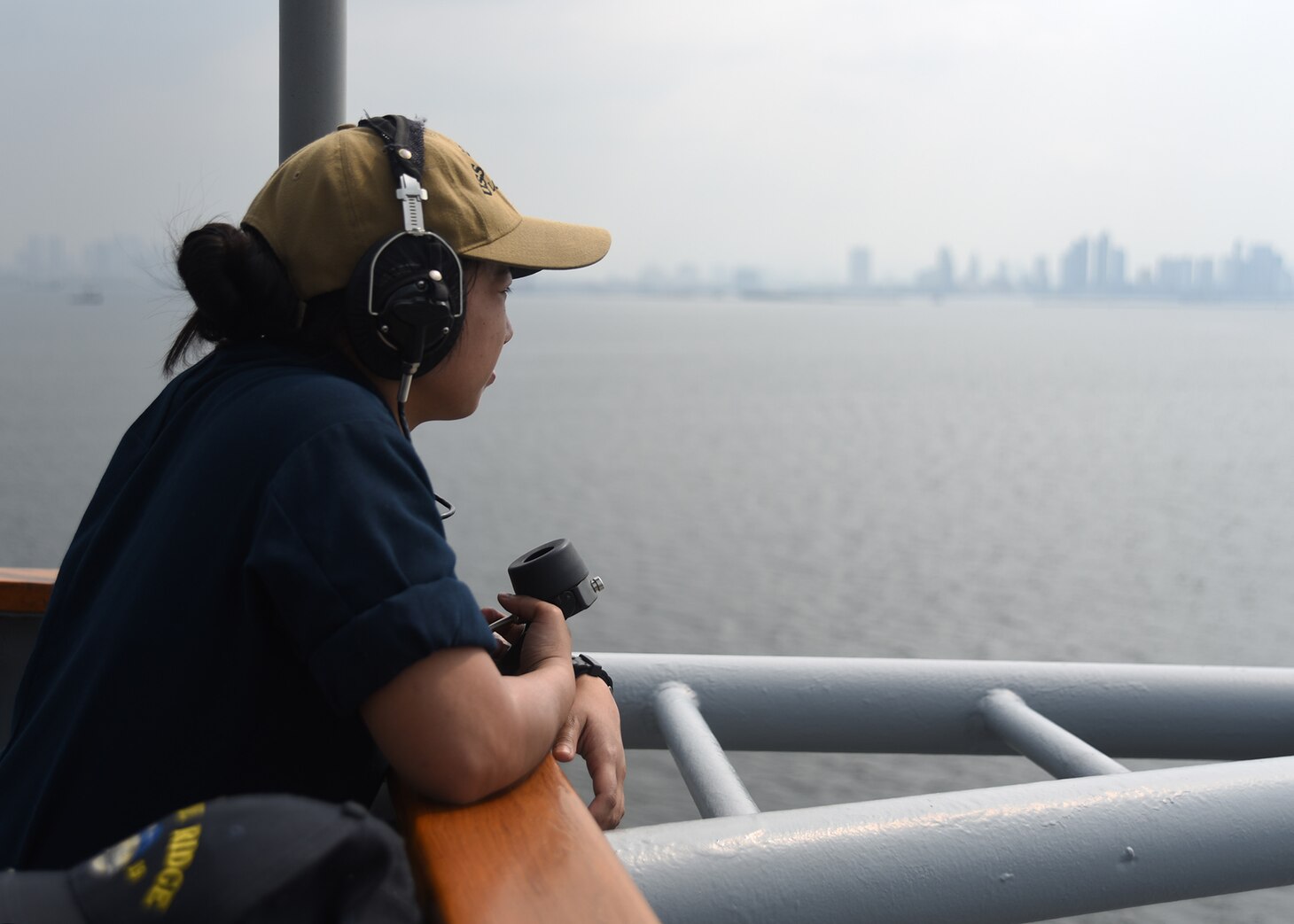 MANILA, Philippines (March 13, 2019) - Quartermaster Seaman Irish Catibog, from Guam, performs her duties as a lookout aboard U.S. 7th Fleet Flagship USS Blue Ridge (LCC 19) as the ship arrives for a port visit to Manila, Philippines. Blue Ridge is the oldest operational ship in the Navy, and as 7th Fleet command ship, is responsible for fostering relationships within the Indo-Pacific Region.