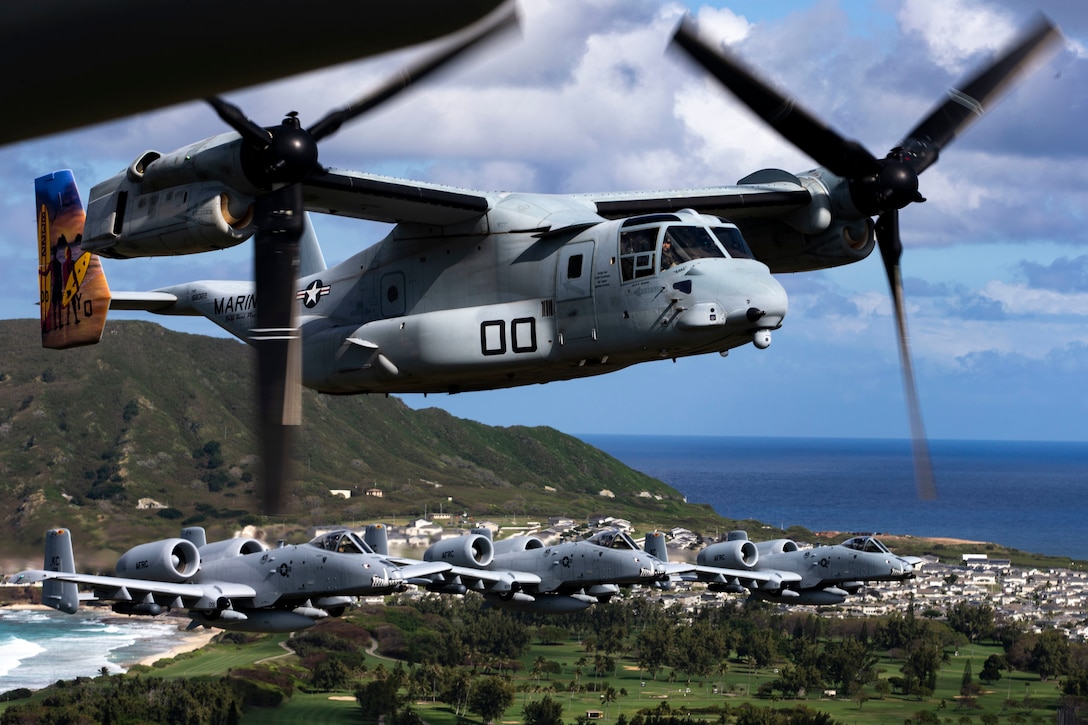 U.S. Air Force A-10 Thunderbolt II aircraft assigned to the 442nd Fighter Wing, Whiteman Air Force Base, Missouri, escort MV-22B Osprey aircraft assigned to Marine Medium Tiltrotor Squadron 268 over Hawaii, Feb. 26, 2019. U.S. Marines with Weapons Company, 2nd Battalion, 3rd Marine Regiment and VMM-268 along with A-10 Thunderbolt II aircraft conducted training including a simulated tactical recovery of aircraft personnel scenario and a combat search and rescue scenario.